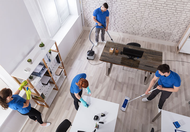 https://officecleaningmiltonkeynes.co.uk/wp-content/uploads/2026/04/cleaning-team-tidying-up-office.jpg